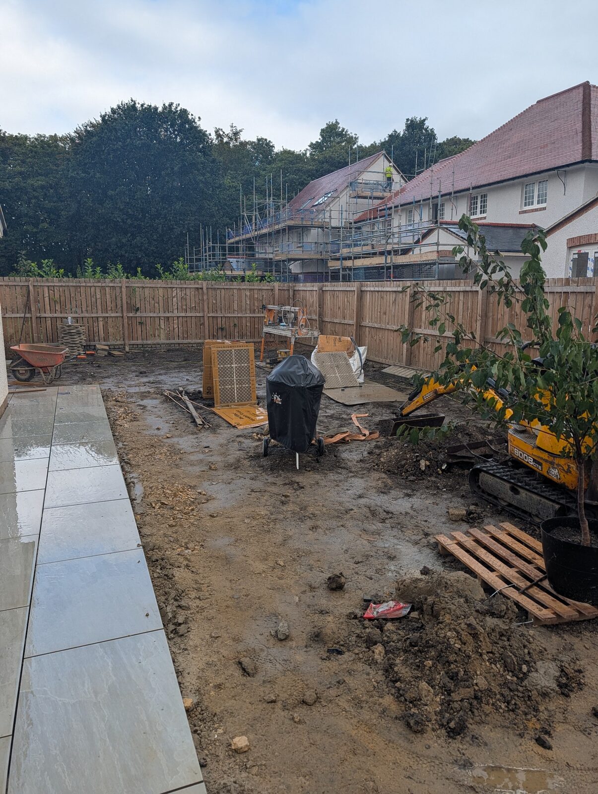 Paving underway beside an active prepared work area