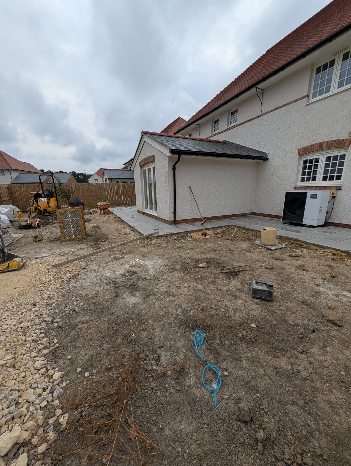 Set-out work across the exposed garden surface