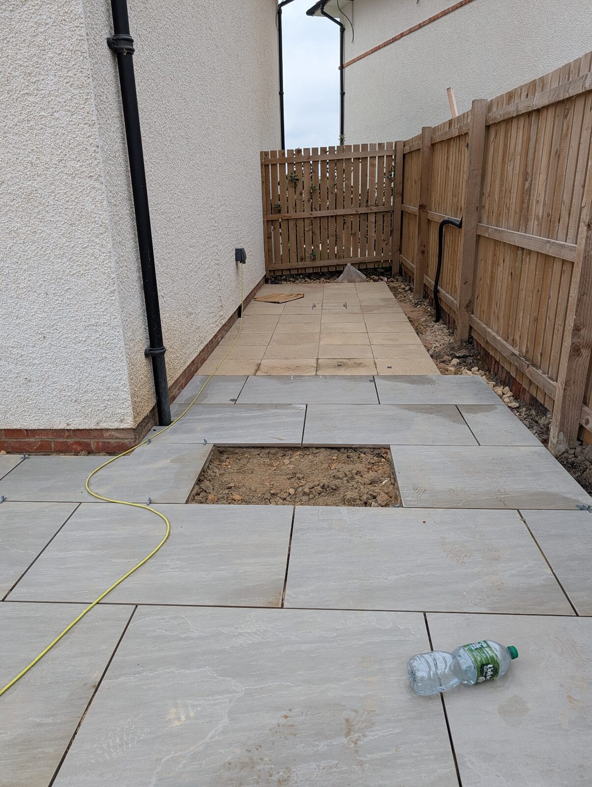 Paving laid through the side garden area