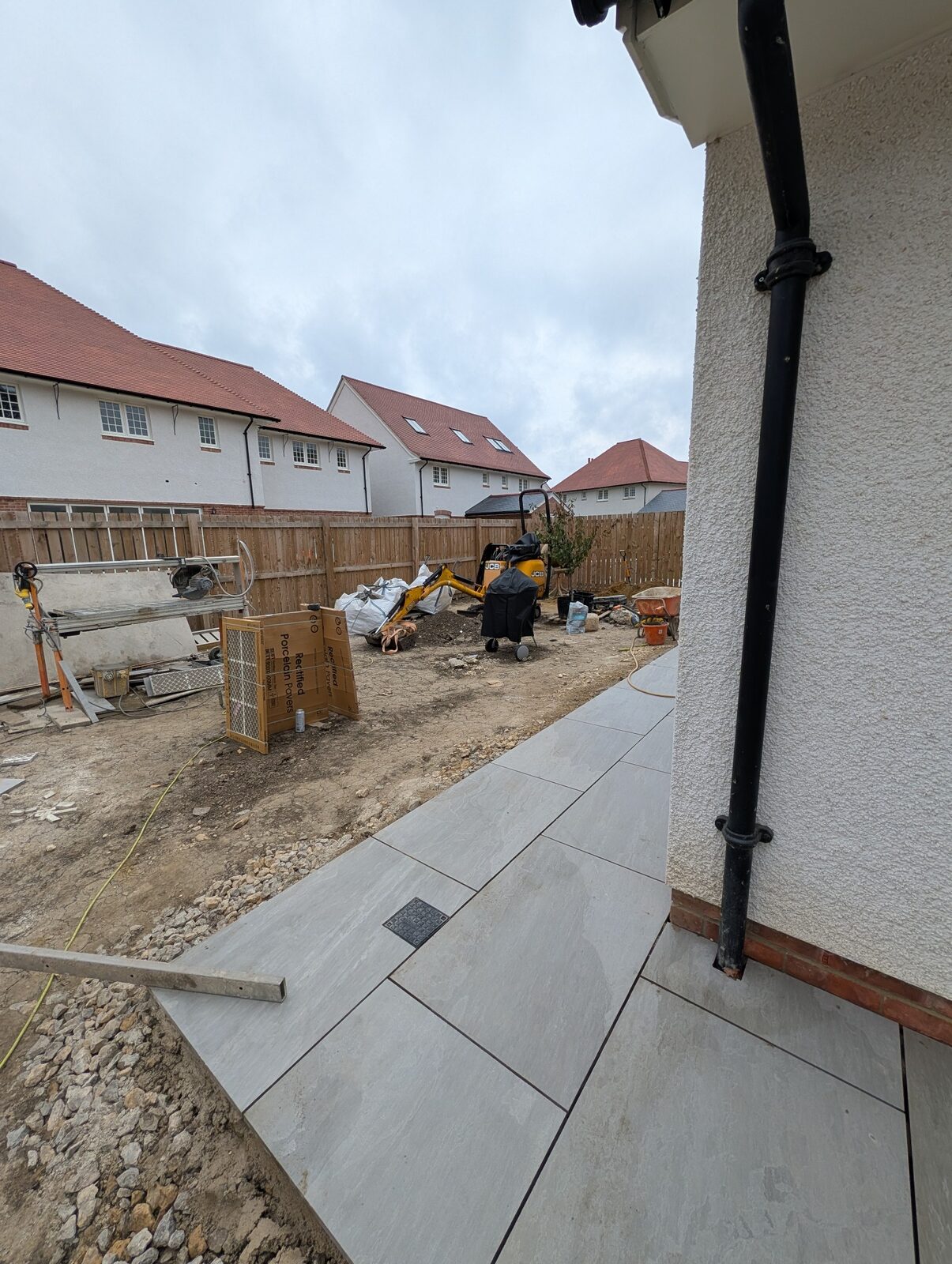 Paving extending into the developing garden