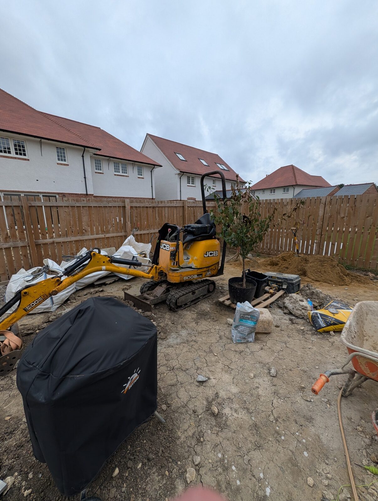 Construction work progressing through the garden