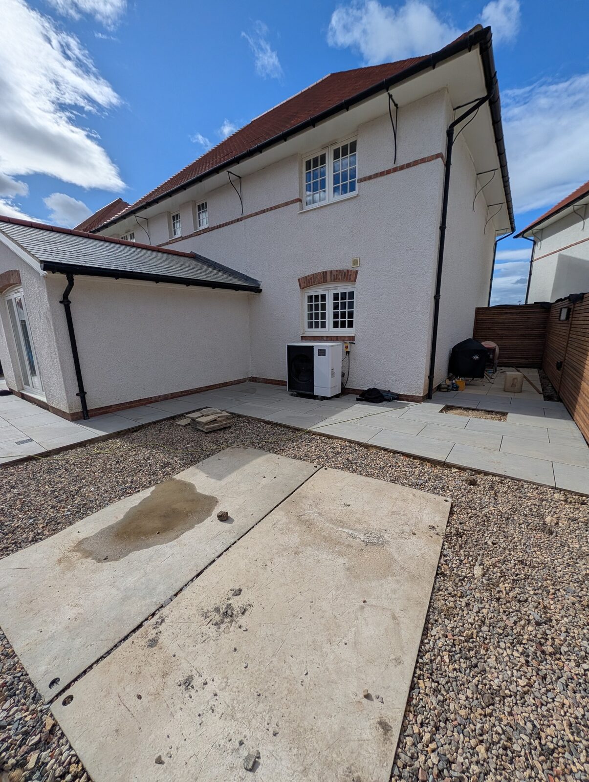 Paving and timber screening beside the property