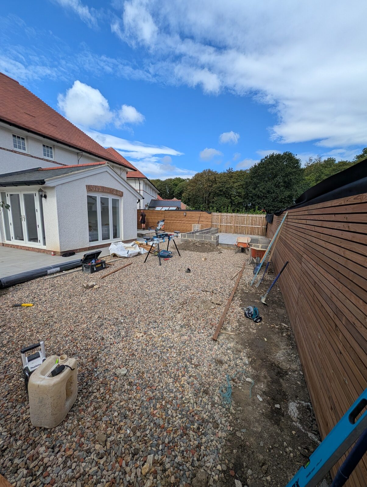 Paved terrace and adjacent garden area in progress